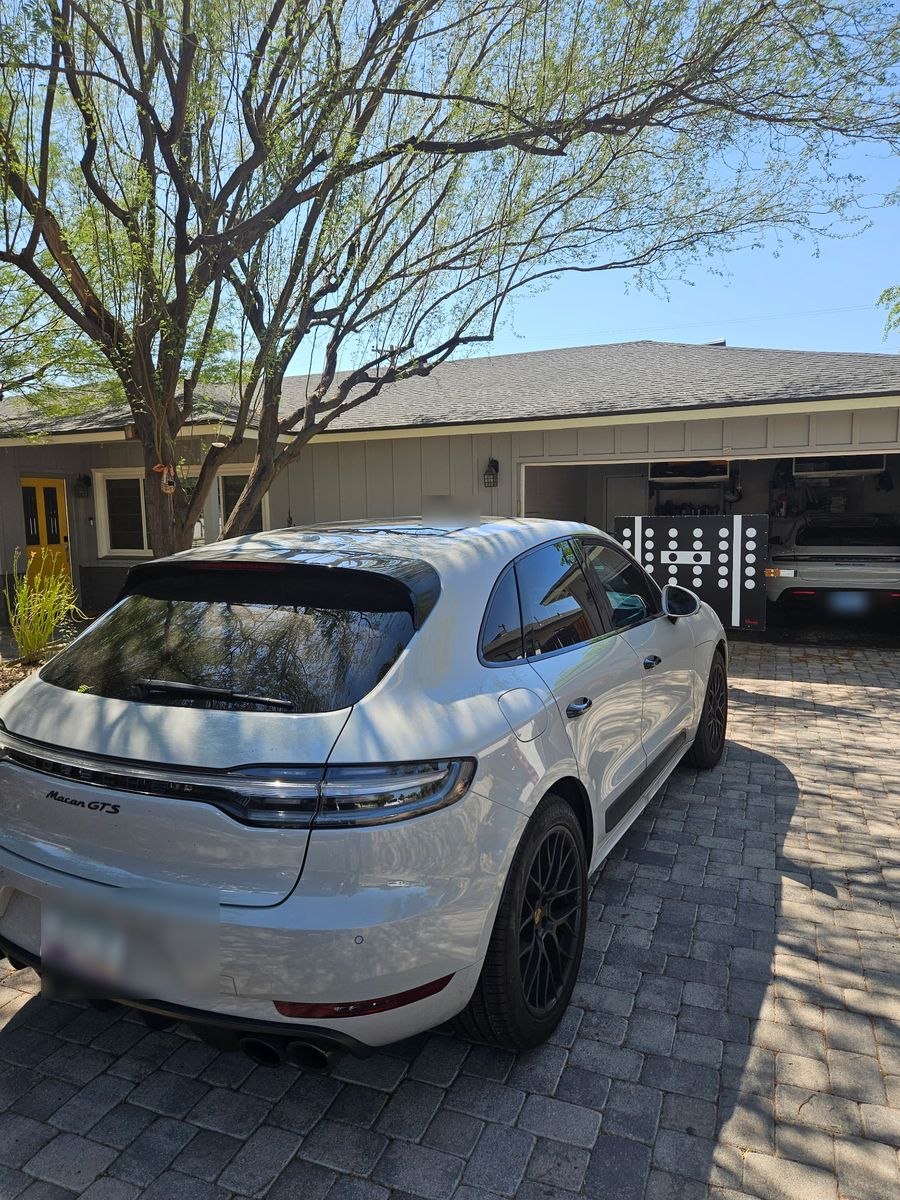 ADAS calibration target board set up behind a Porsche Macan GTS after a windshield replacement