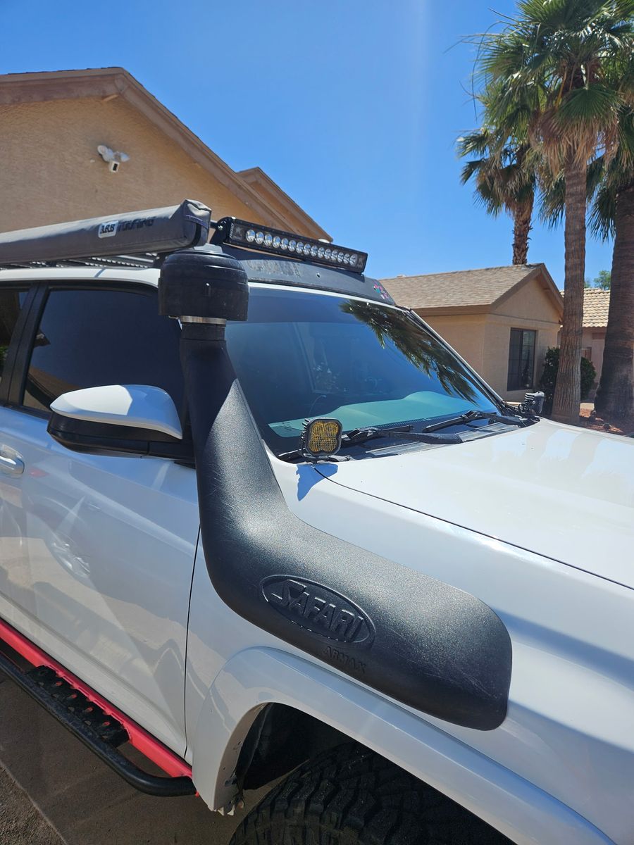 Lifted Toyota 4Runner with snorkel and light bar after a windshield replacement