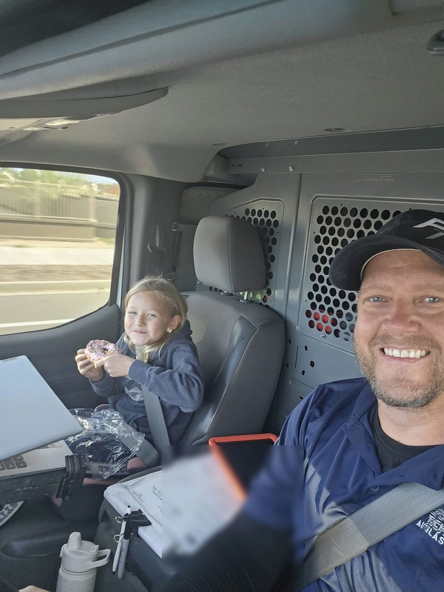 Owen and his daughter riding along in the Perfect Touch van